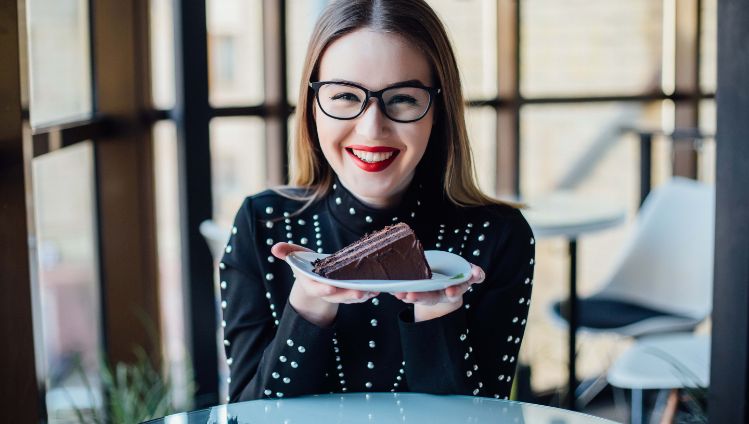 woman holding slide of cake copy_web